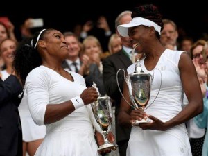 Britain Tennis - Wimbledon - All England Lawn Tennis & Croquet Club, Wimbledon, England - 9/7/16 USA's Serena Williams and Venus Williams celebrate winning their womens doubles final against Hungary's Timea Babos and Kazakhstan's Yaroslava Shvedova with the trophies REUTERS/Tony O'Brien