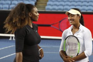 United States' Serena Williams, left, talks with Australian player Destanee Aiava during a promotional event on Margaret Court Arena ahead of the Australian Open tennis championships in Melbourne, Australia, Thursday, Jan. 12, 2017. Aiava will be the first player born this century to play in the main draw match at a tennis major. (AP Photo/Mark Baker)
