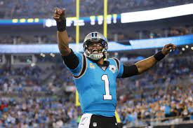 CAM NEWTON IS BACK IN THE NFL. THE CAROLINA PANTHERS OWNER,  AND HEAD COACH MADE THE GREATEST DECISION OF THEIR SHORT NFL CAREERS, BRINGING BACK THEIR FORMER STARTING Q.B. WHO HAS BEEN AN,  “NFL Most Valuable Player (2015)”,     “NFL Offensive Player of the Year (2015)”,     “NFL Offensive Rookie of the Year (2011)”,     “First-team All-Pro (2015)”,      “3× Pro Bowl (2011, 2013, 2015)”,      “PFWA All-Rookie Team (2011)”, and a      “Bert Bell Award (2015)” recipient.